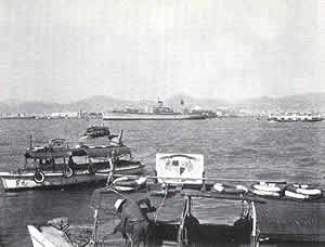 Hong Kong water taxis shuttling sailors from the Klondike to shore and back.